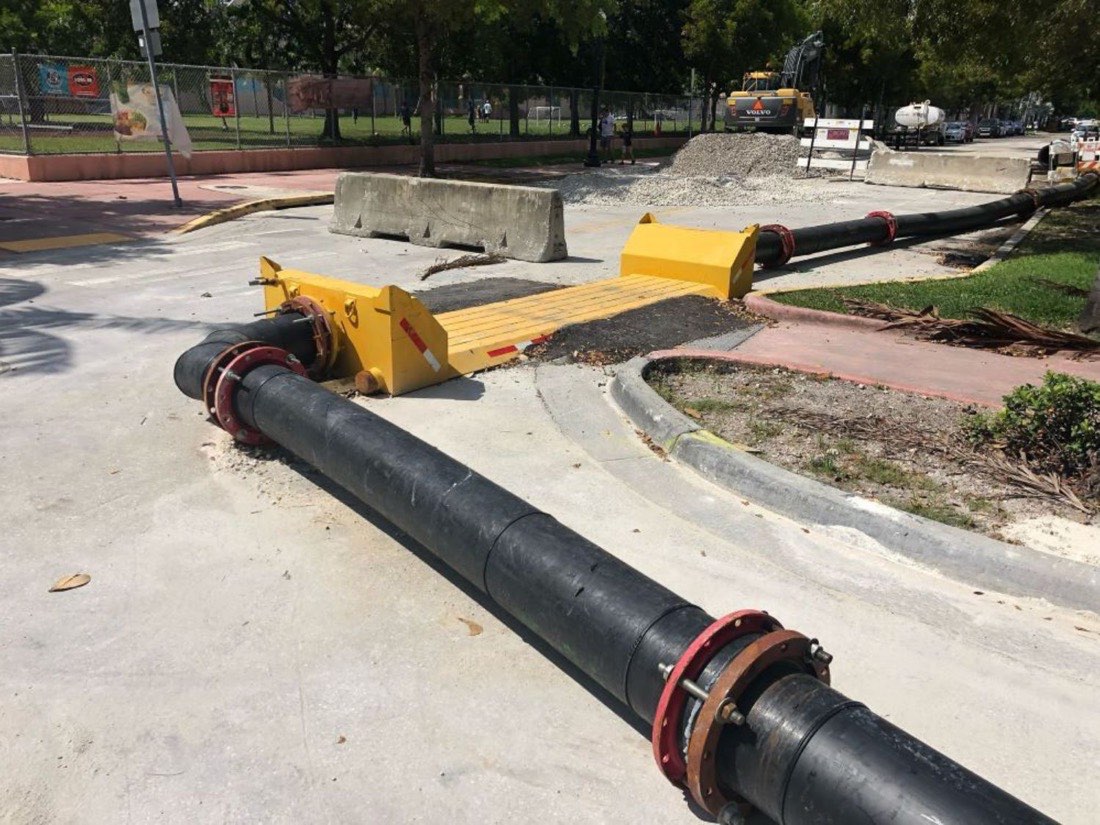 HDPE discharge line with a crossing ramp routed through a jobsite